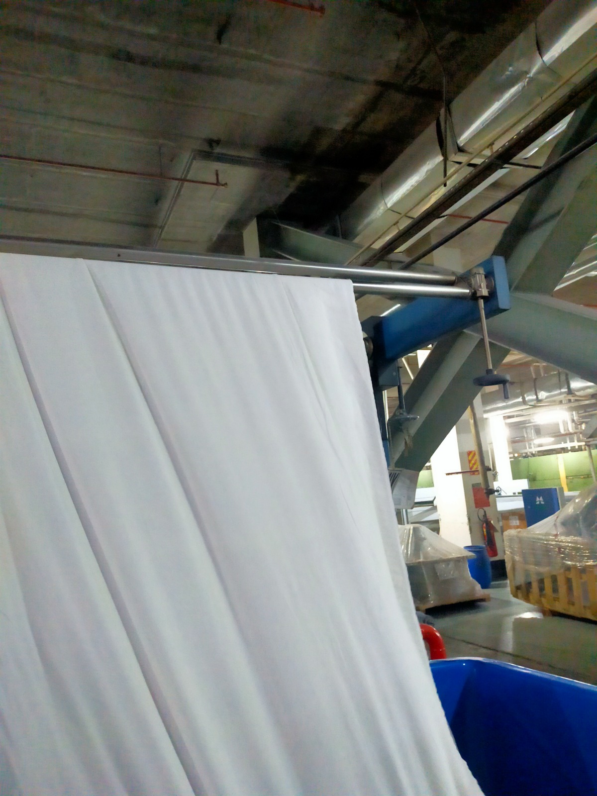 White fabric running on the finishing line